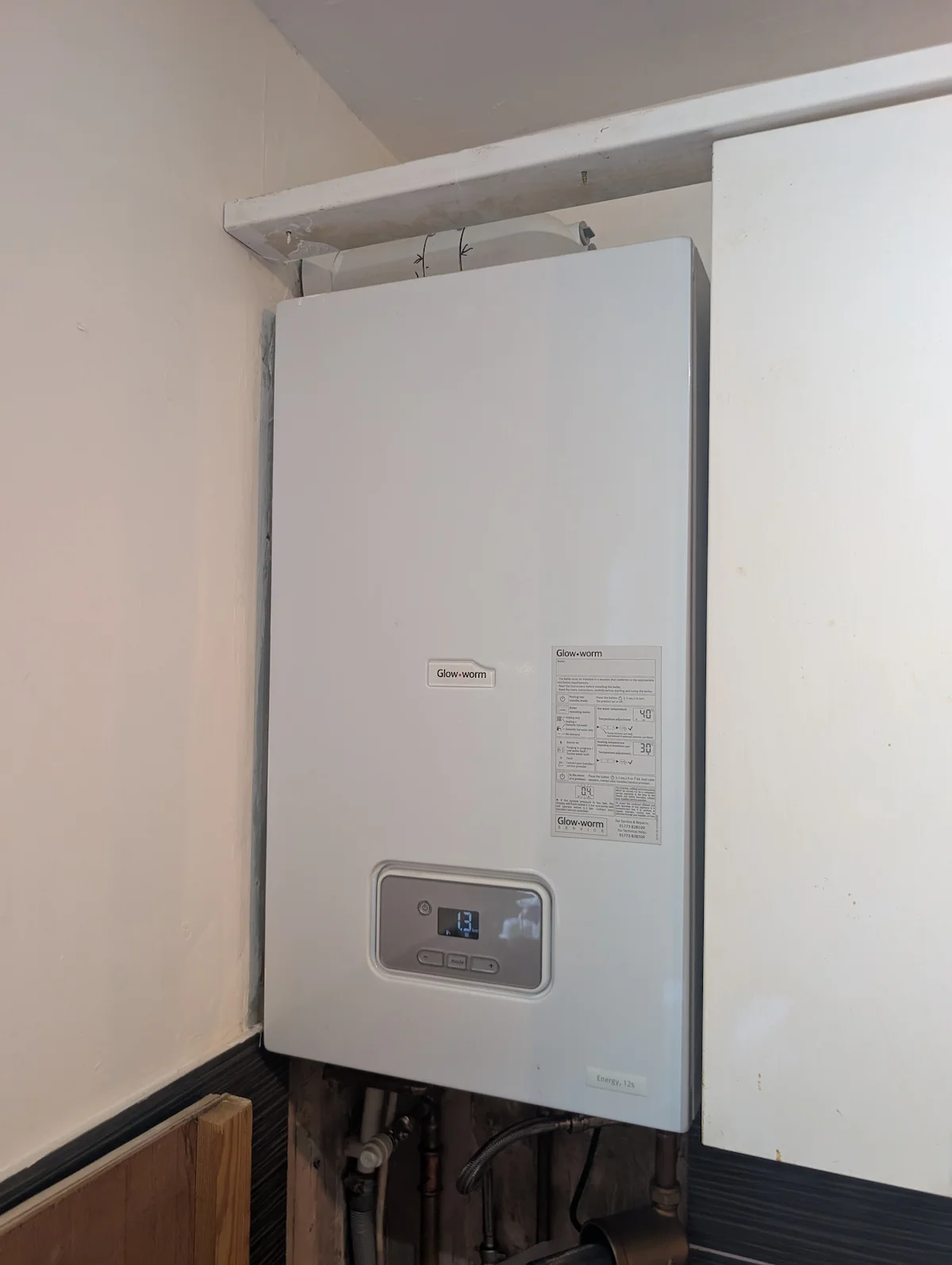 Gas Safe engineer servicing a boiler for The Happy Heating Co in West London