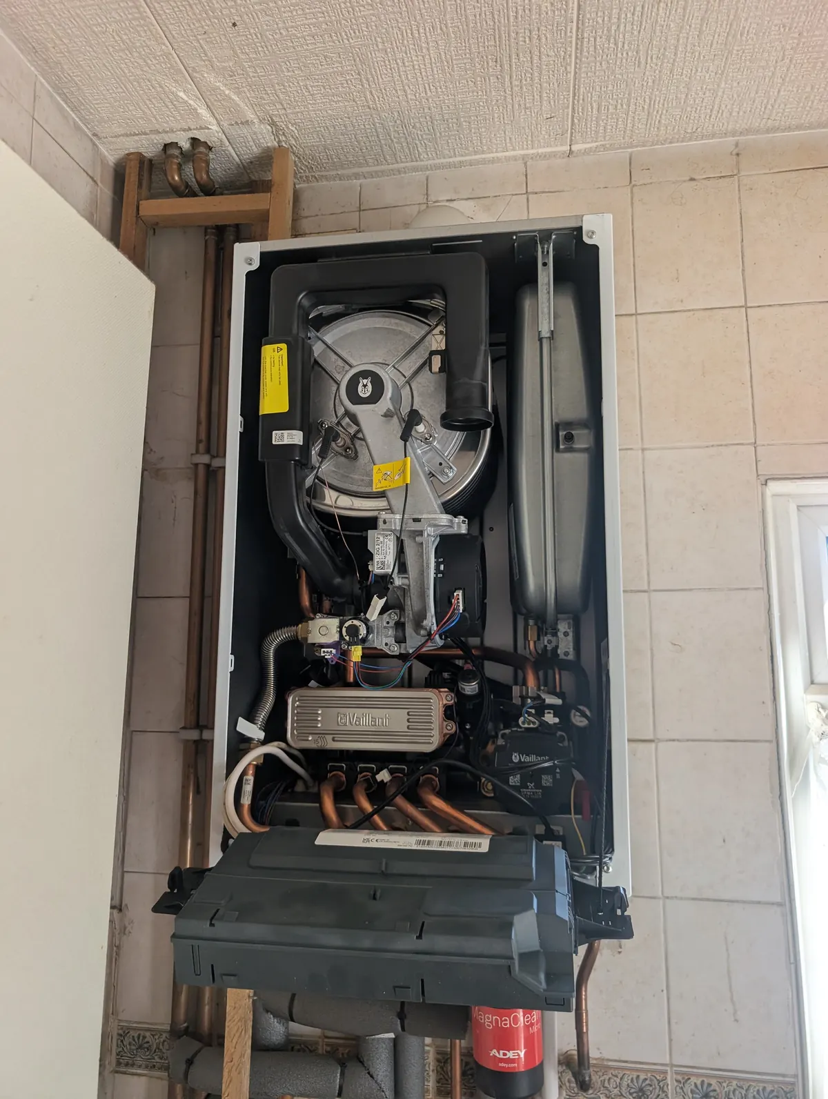 Vaillant boiler with the casing off during a repair visit by The Happy Heating Co