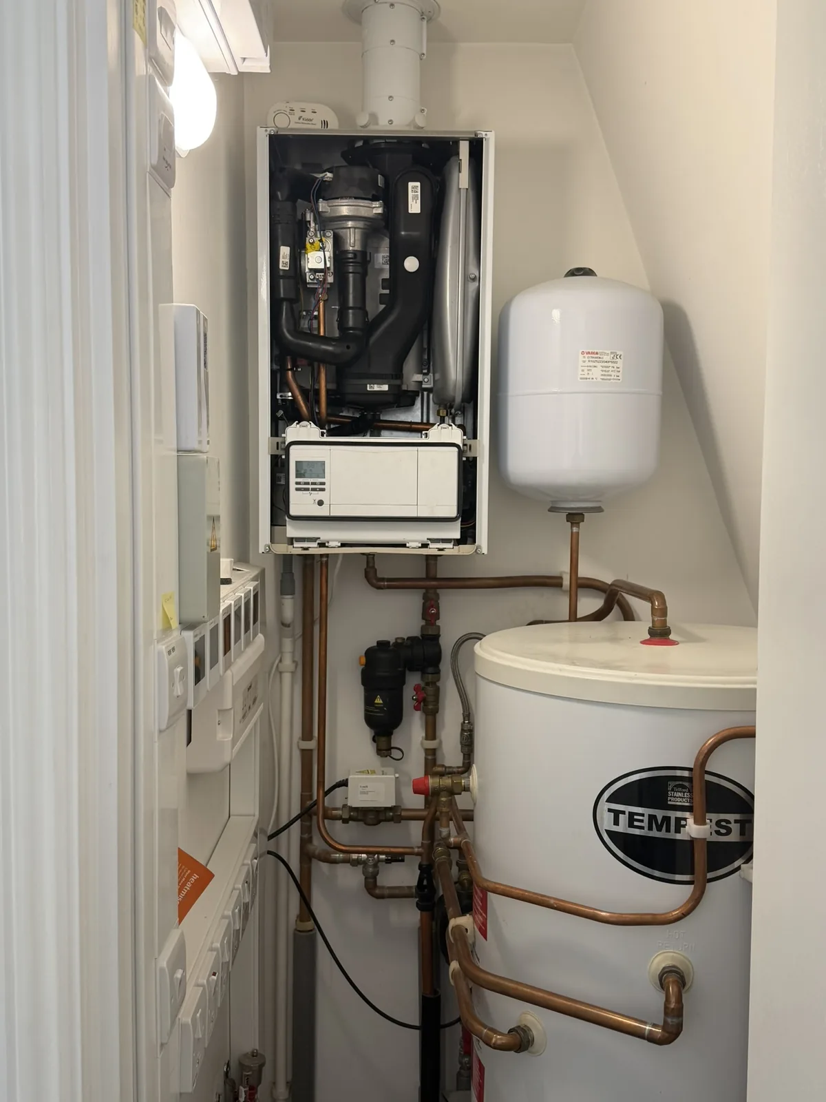 System boiler, magnetic system filter and unvented cylinder during a boiler repair visit by The Happy Heating Co in Westminster, London
